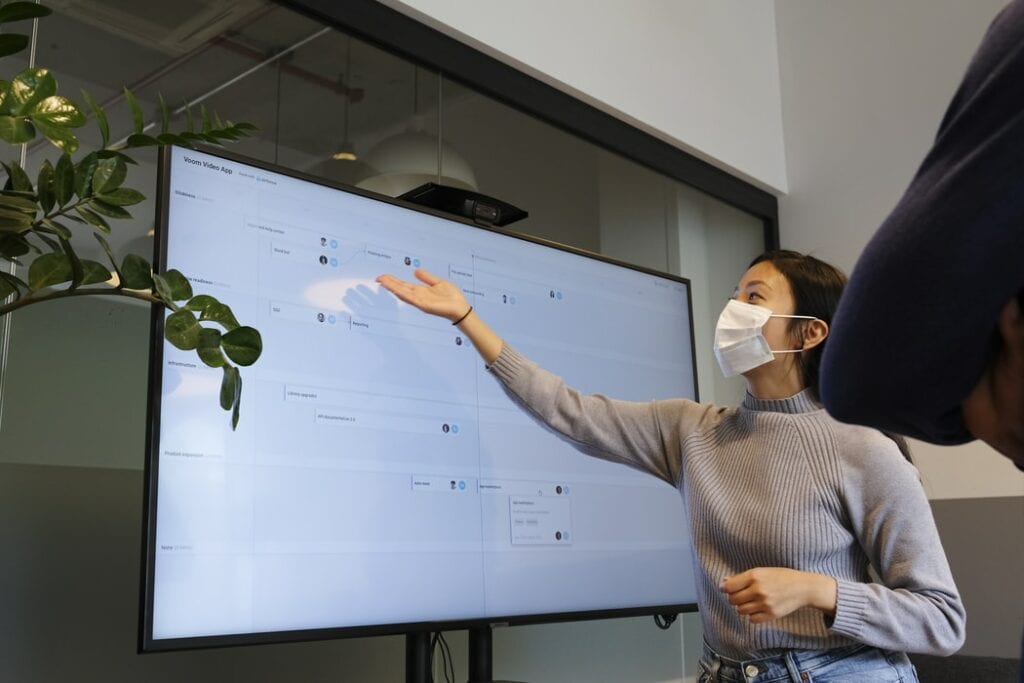 A business professional using her software skills to make a presentation.