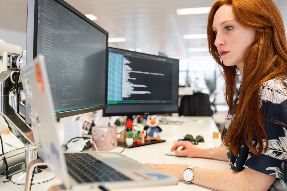 Programmer working with different operating systems at the same time